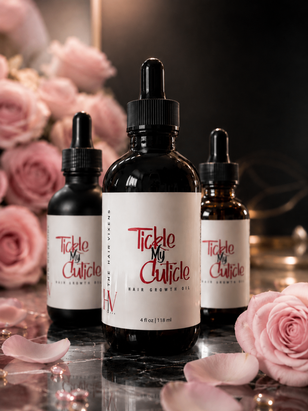 Tickle My Cuticle hair growth oil on a black marble pedestal